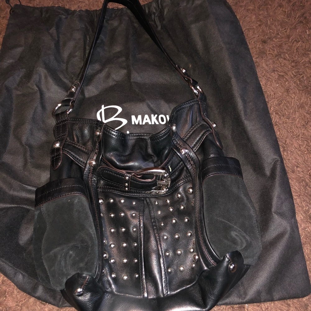 Black shoulder bag. Great condition. Dust cover.